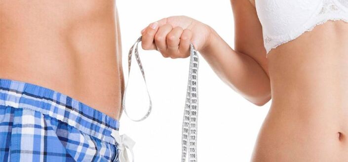 Woman measures man's penis before enlargement